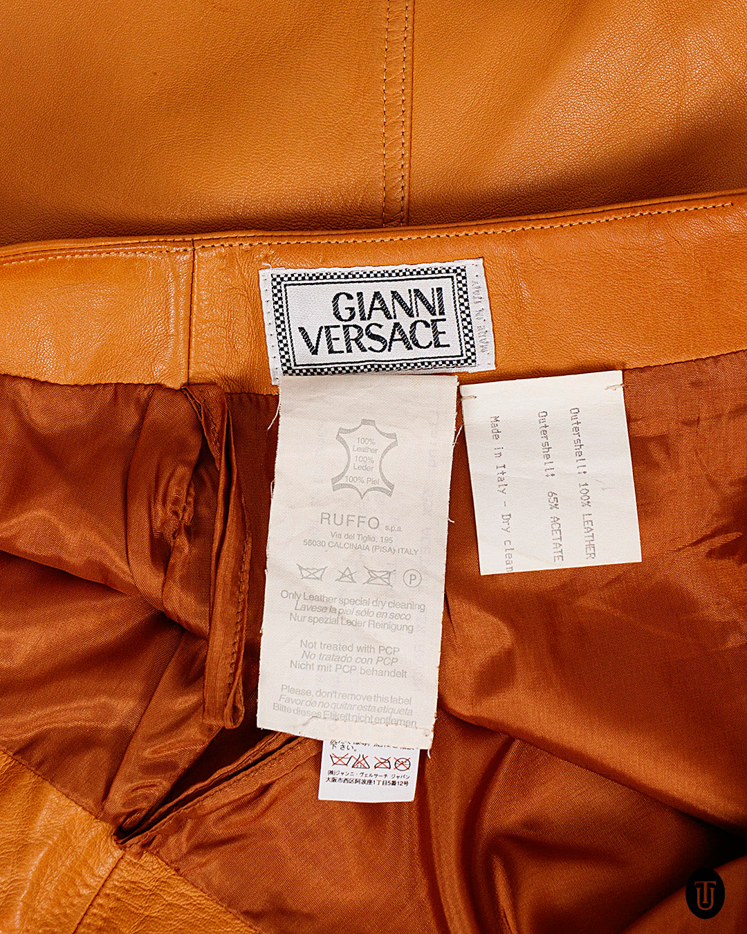 An 80s Gianni Versace leather mini skirt S